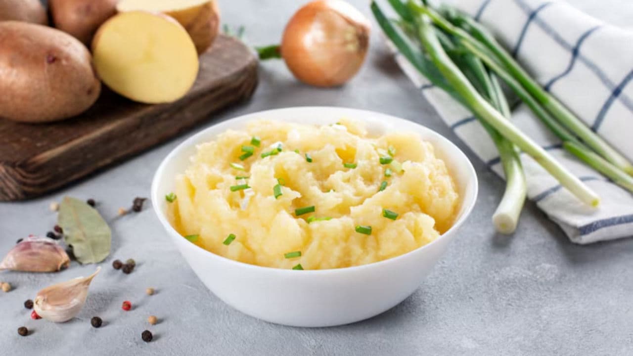 Creamy mashed potatoes with fresh garnish