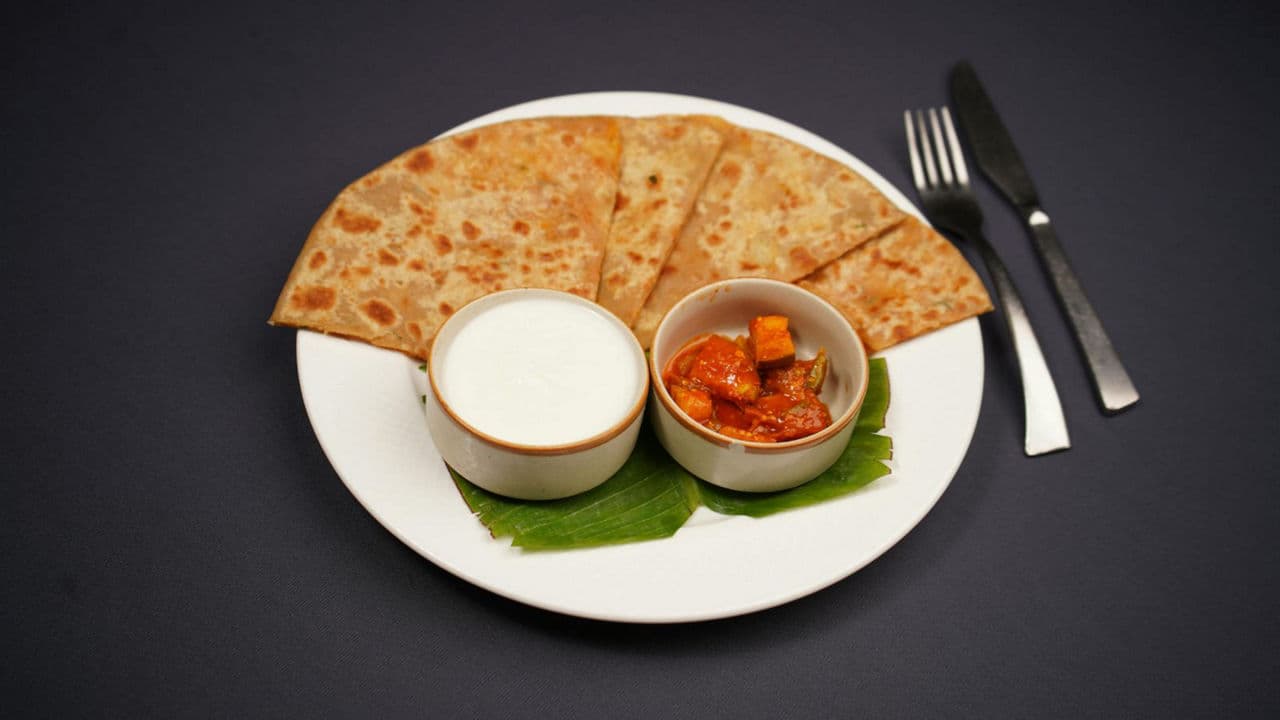 Indian flatbread with yogurt and pickle